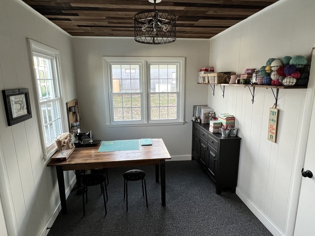 12 Sawmill Road Dudley, MA 01571 - Photo 35 of 37 a room with furniture a window and wooden floor