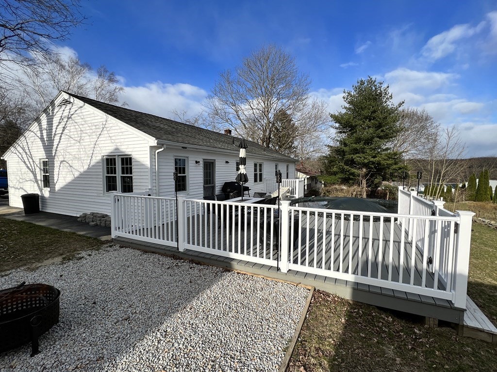 12 Sawmill Road Dudley, MA 01571 - Photo 6 of 37 a porch with a bench