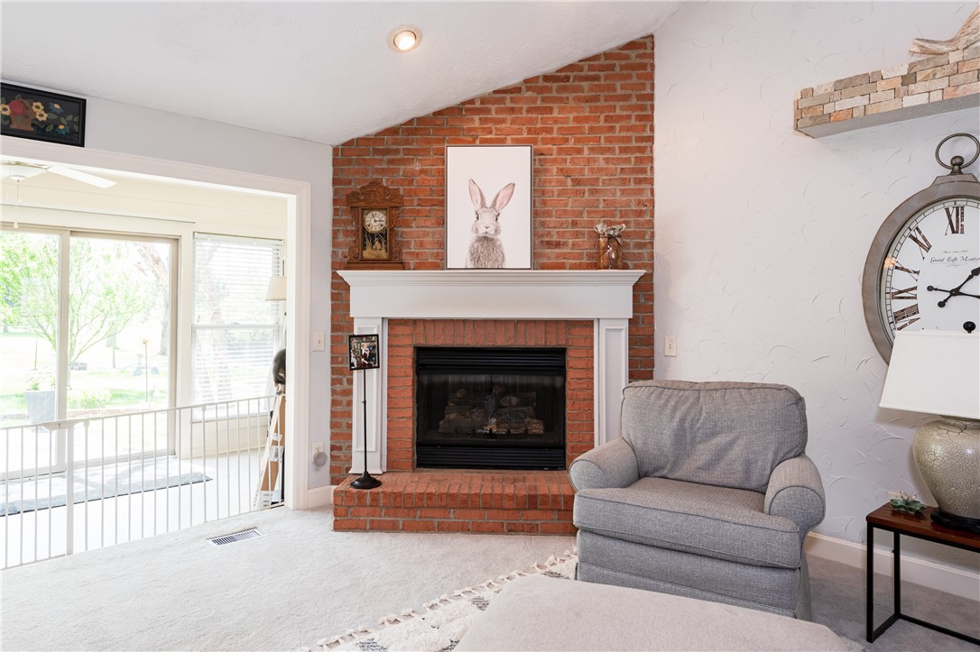 159 East Lytle 5 Points Road Springboro, OH 45066 - Photo 29 of 45 This living room offers a brick fireplace and access to an enclosed porch.