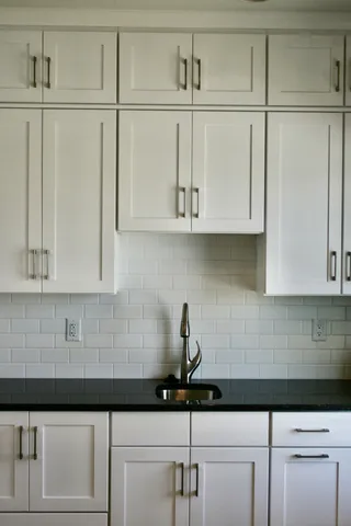 a kitchen with a sink and cabinets