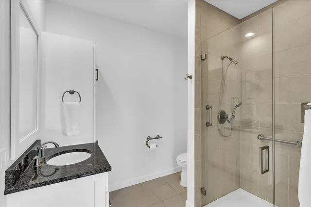 a bathroom with a sink and shower