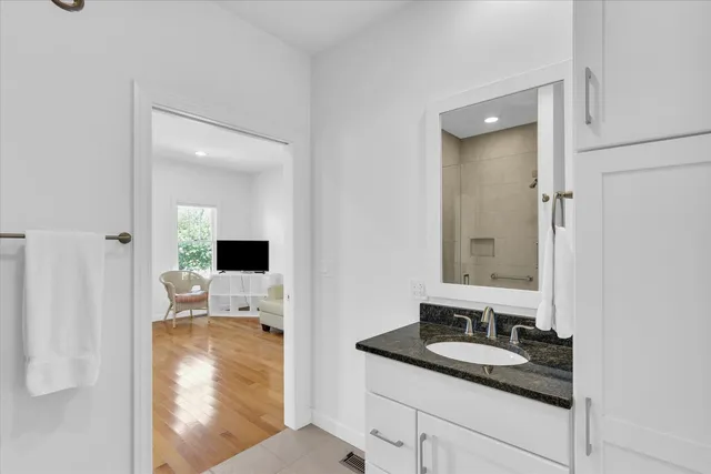 a en suite bathroom with a sink and mirror