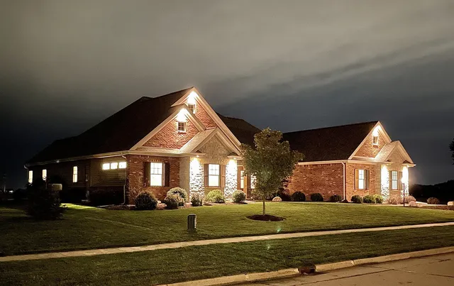 a front view of a house with a yard