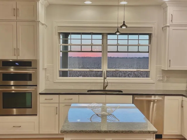 a kitchen with a stove and a microwave