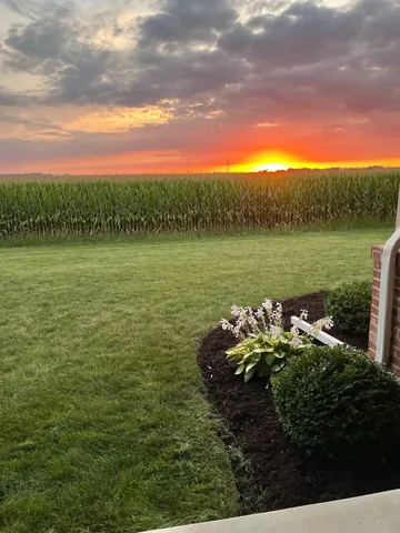 a view of a lake with a yard