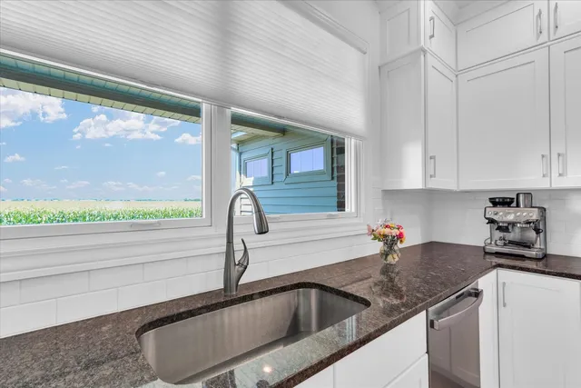 a kitchen with a sink and cabinets