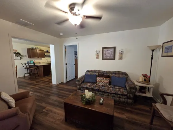 a bedroom with two beds and a large window