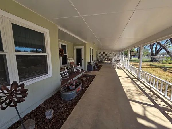 a view of a dining room with furniture wooden floor and a chandelier