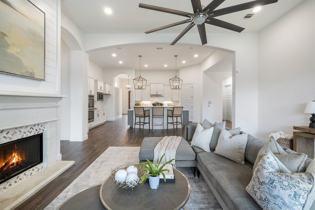 17641 Stratus Cove Dripping Springs, TX 78620 - Photo 19 of 40 a living room with furniture and a fireplace