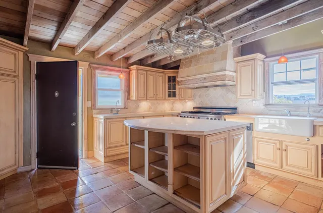 a kitchen with stainless steel appliances granite countertop a stove and a sink