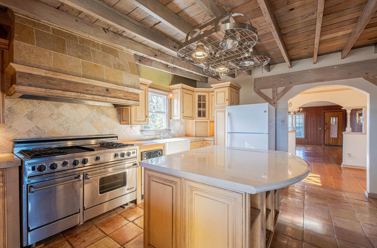 1800 Luxton Street Seaside, CA 93955 - Photo 13 of 48 a kitchen with a stove a refrigerator and a chandelier