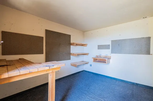 a room with furniture and a flat screen tv