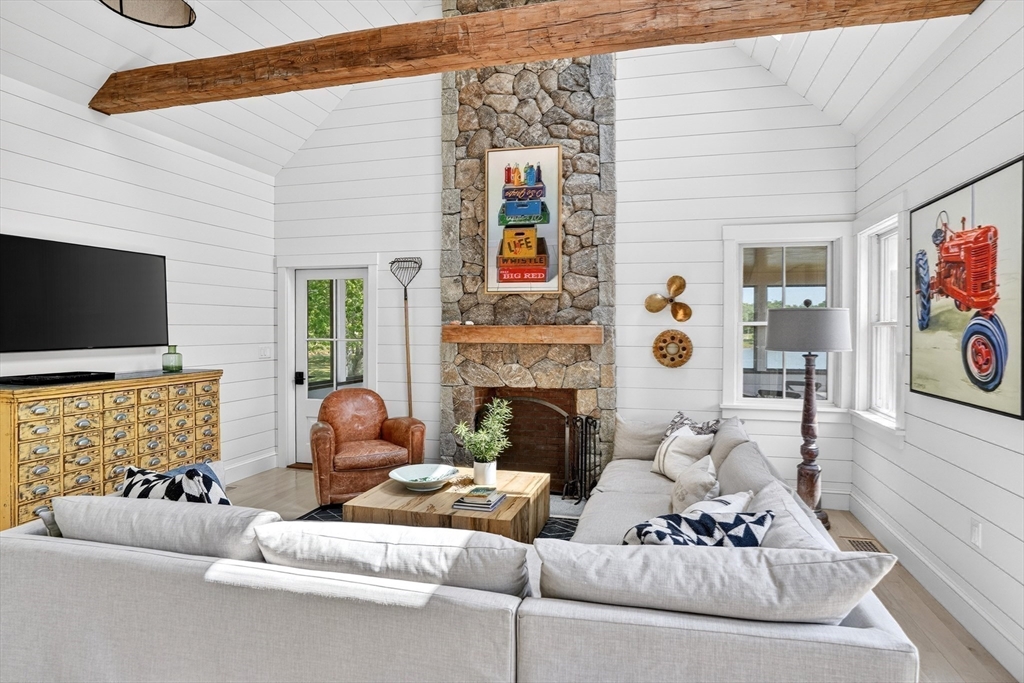 10-12 Boldwater Road Edgartown, MA 02539 - Photo 33 of 41 a living room with furniture and a flat screen tv
