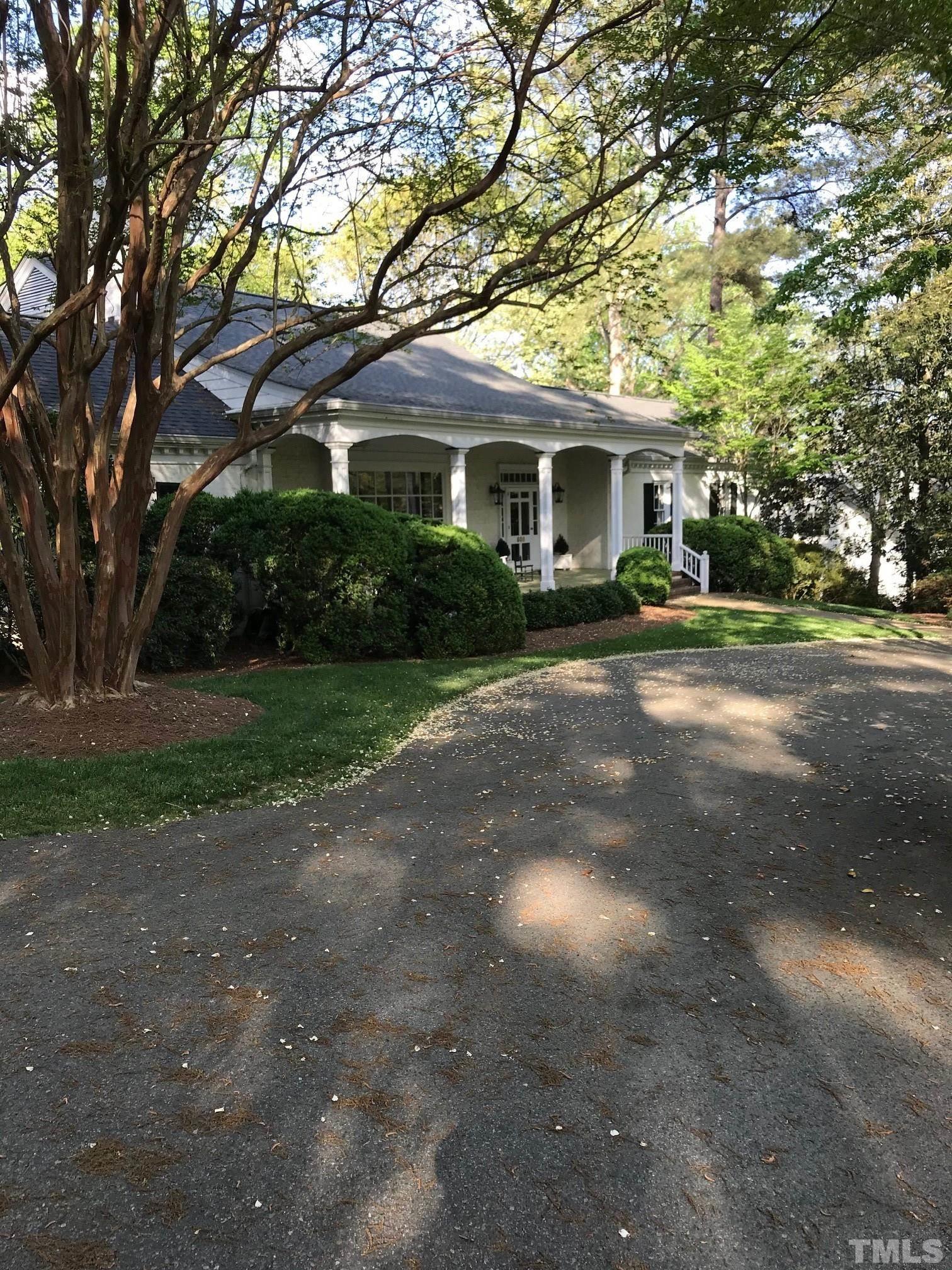 608 Scotland Street Raleigh, NC 27609 - Photo 3 of 3 a front view of a house with a garden and trees