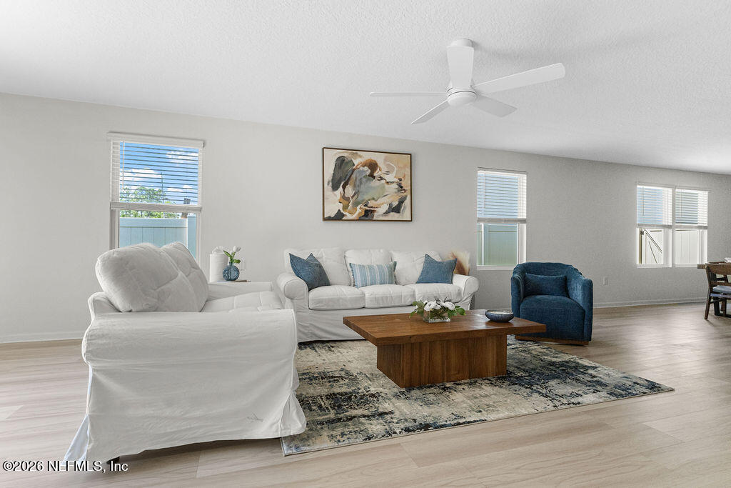 75394 Bridgewater Drive Yulee, FL 32097 - Photo 11 of 55 a living room with furniture wooden floor and window