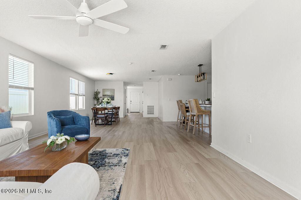 75394 Bridgewater Drive Yulee, FL 32097 - Photo 13 of 55 a living room with furniture and a wooden floor