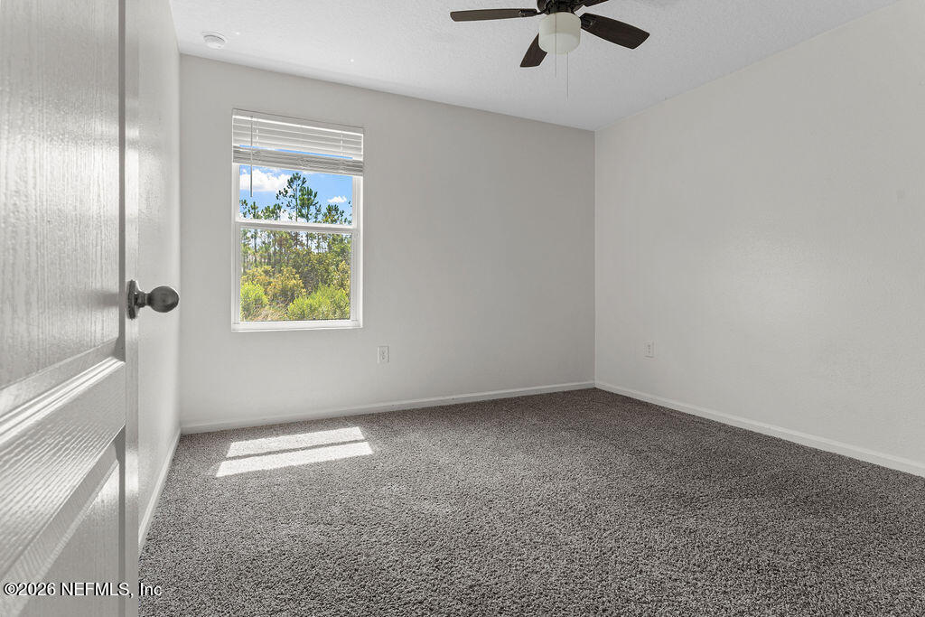 75394 Bridgewater Drive Yulee, FL 32097 - Photo 19 of 55 a view of an empty room with a window