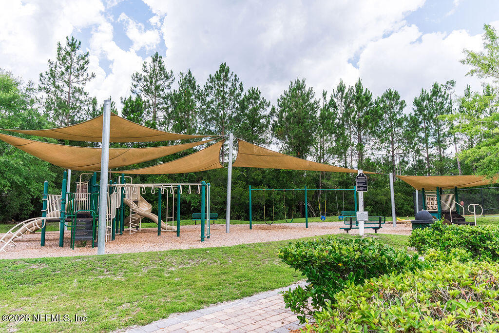 75394 Bridgewater Drive Yulee, FL 32097 - Photo 25 of 55 a view of a house with backyard and porch