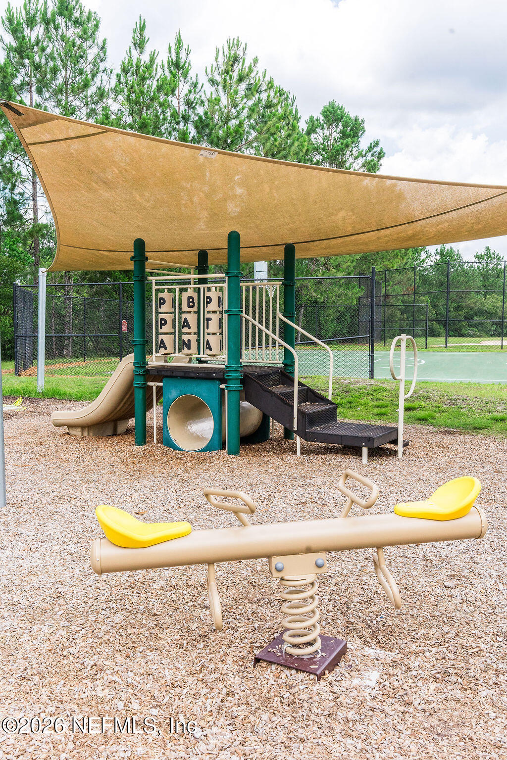 75394 Bridgewater Drive Yulee, FL 32097 - Photo 28 of 55 an aerial view of a house with swimming pool and a yard