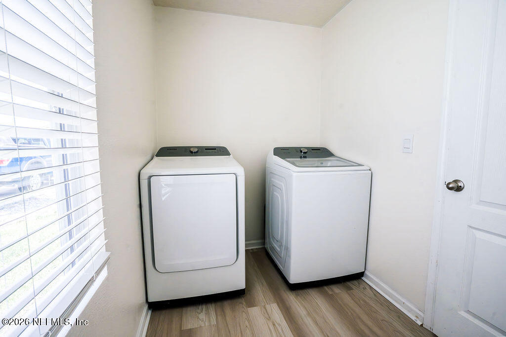 75394 Bridgewater Drive Yulee, FL 32097 - Photo 33 of 55 a utility room with wooden floor washer and dryer