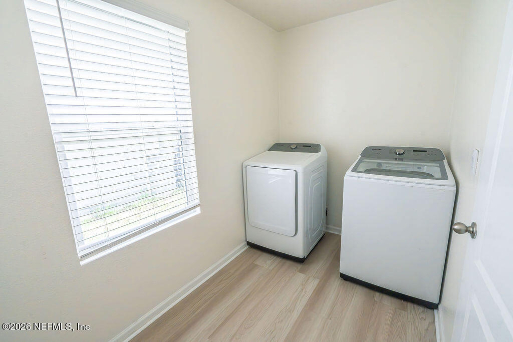 75394 Bridgewater Drive Yulee, FL 32097 - Photo 34 of 55 a utility room with dryer and washer