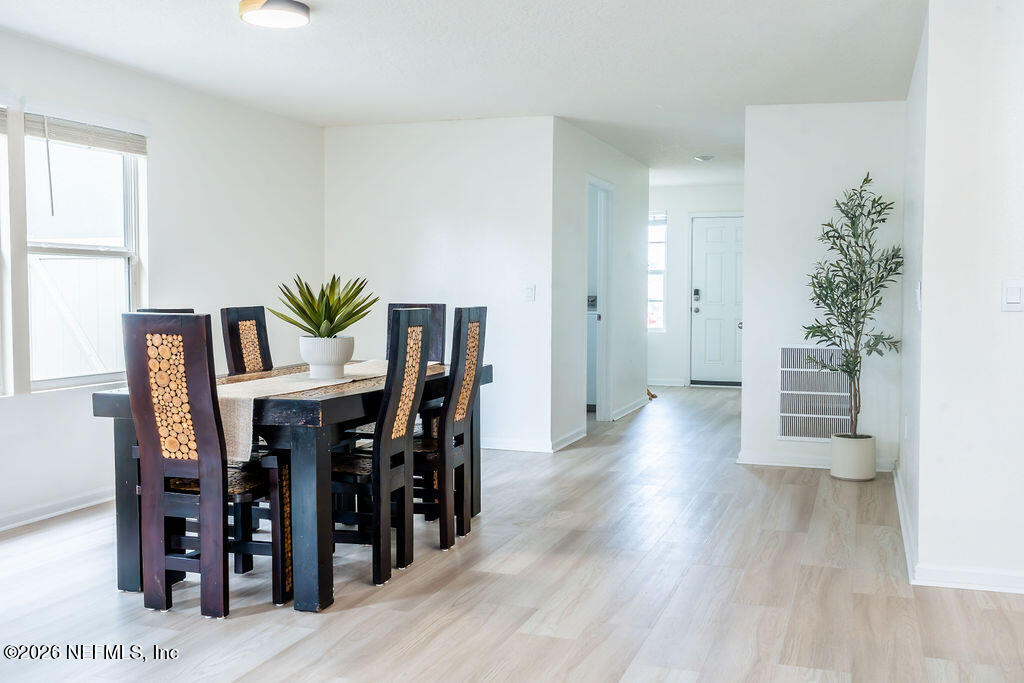 75394 Bridgewater Drive Yulee, FL 32097 - Photo 36 of 55 a view of a dining room with furniture and wooden floor