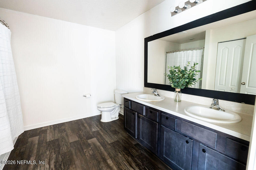 75394 Bridgewater Drive Yulee, FL 32097 - Photo 38 of 55 a bathroom with a sink and a mirror