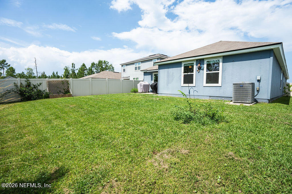 75394 Bridgewater Drive Yulee, FL 32097 - Photo 47 of 55 a house view with a garden space