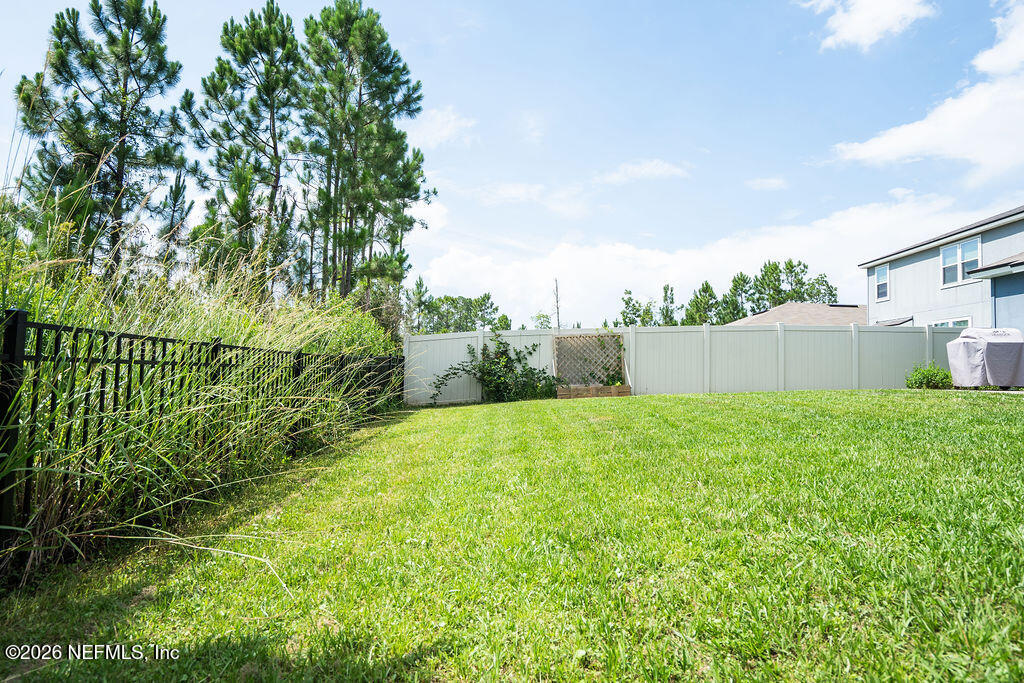 75394 Bridgewater Drive Yulee, FL 32097 - Photo 48 of 55 a view of a backyard