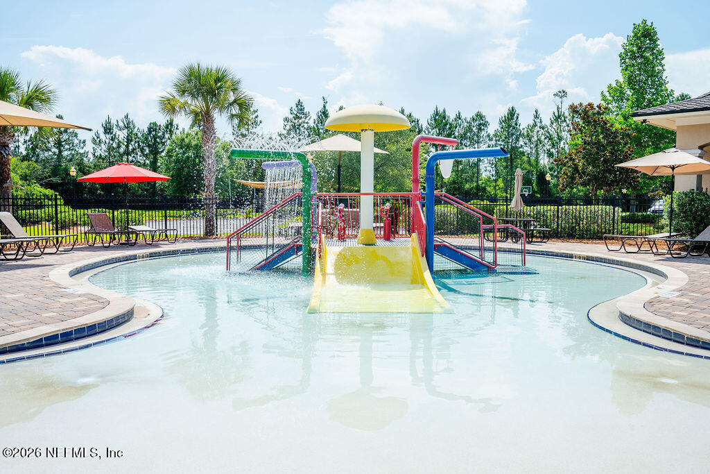 75394 Bridgewater Drive Yulee, FL 32097 - Photo 53 of 55 a view of a swimming pool with a patio