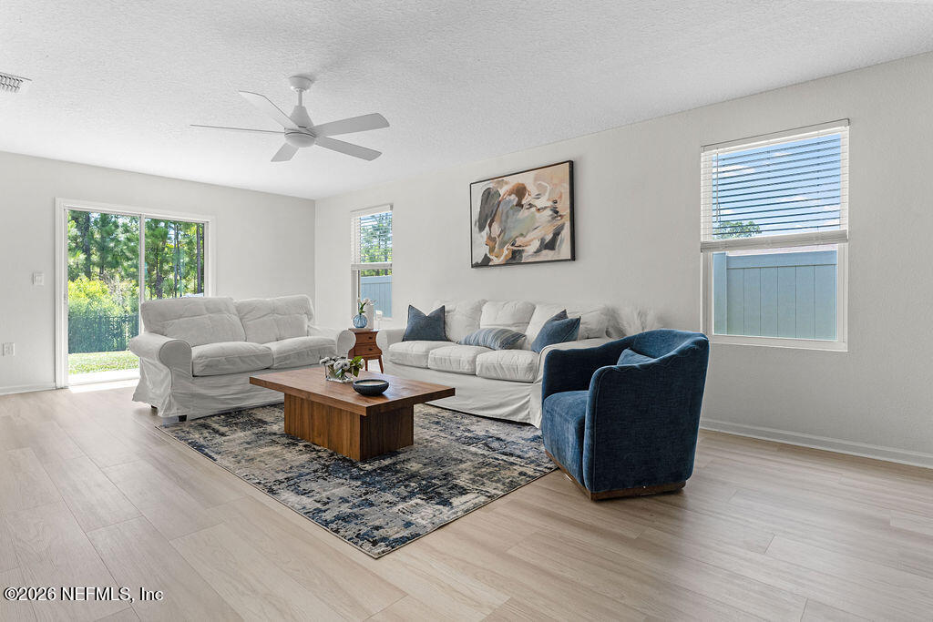 75394 Bridgewater Drive Yulee, FL 32097 - Photo 9 of 55 a living room with furniture and a window