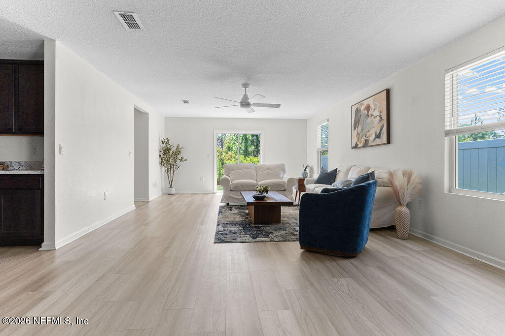75394 Bridgewater Drive Yulee, FL 32097 - Photo 10 of 55 a living room with furniture and a wooden floor