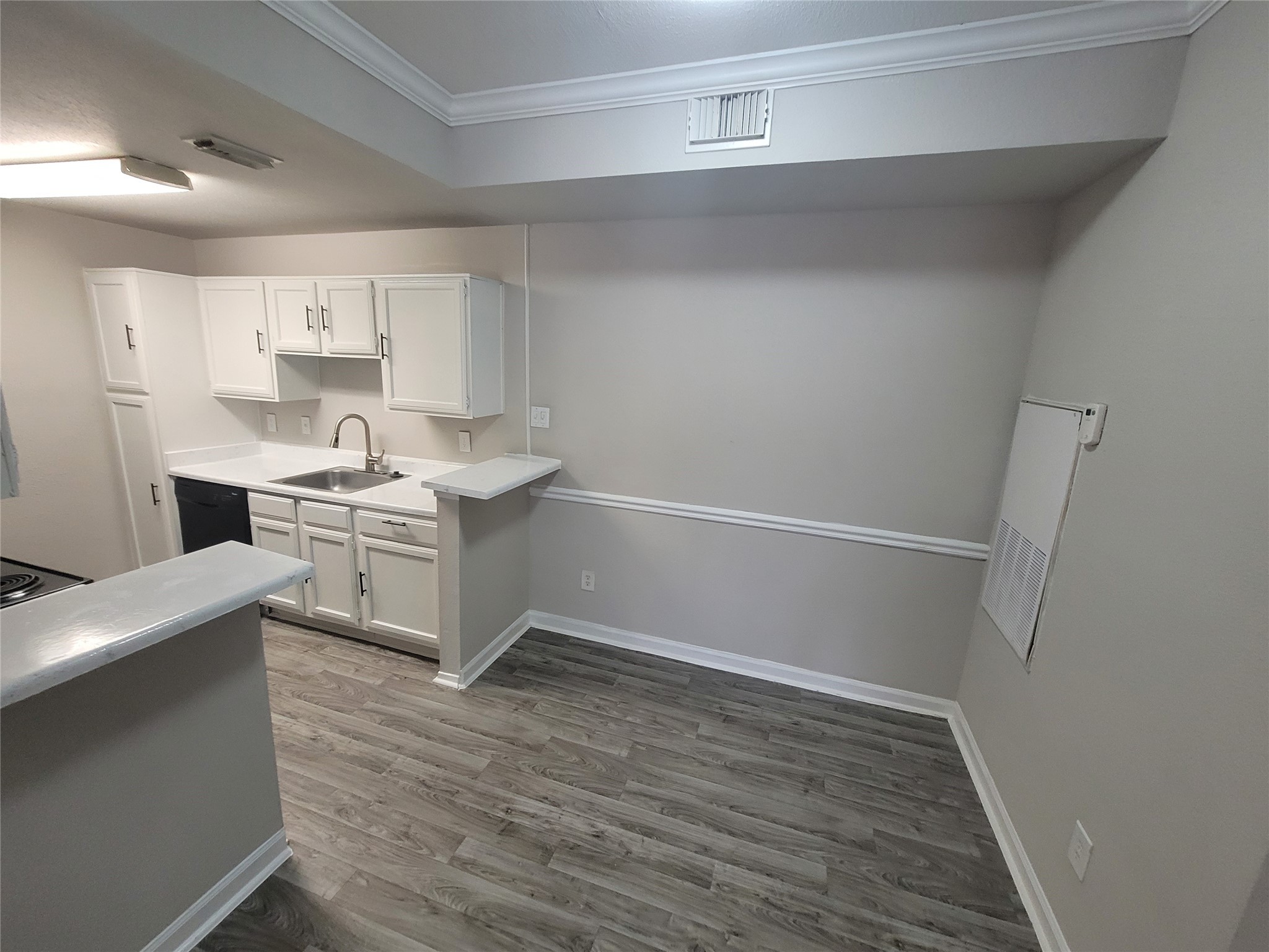 7250 West Greens Road, Unit 108 Houston, TX 77064 - Photo 4 of 9 a room with stainless steel appliances a sink a stove a refrigerator and cabinets