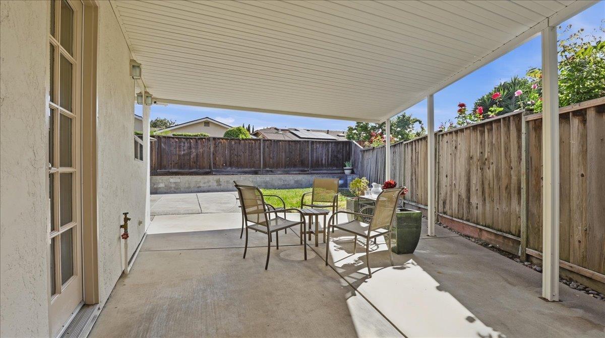 2162 Stratton Place San Jose, CA 95131 - Photo 9 of 12 a view of a patio with table and chairs with wooden fence