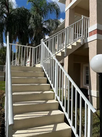 a view of entryway with wooden floor and fence