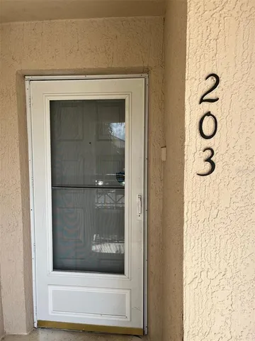 a bathroom with a shower and mirror