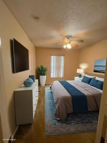 a bedroom with bed and window