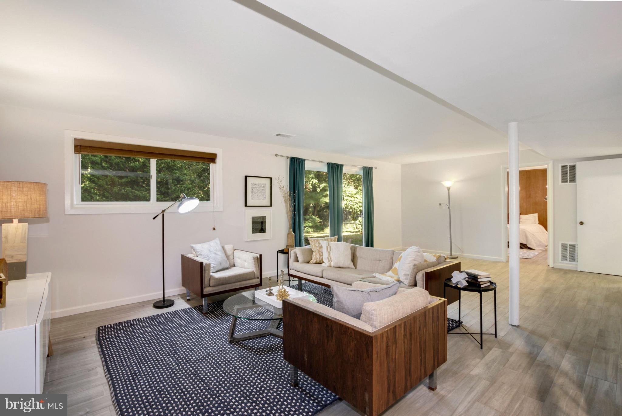 11207 Lombardy Road Silver Spring, MD 20901 - Photo 24 of 32 Lower Level Family Room with Sliding Glass Doors