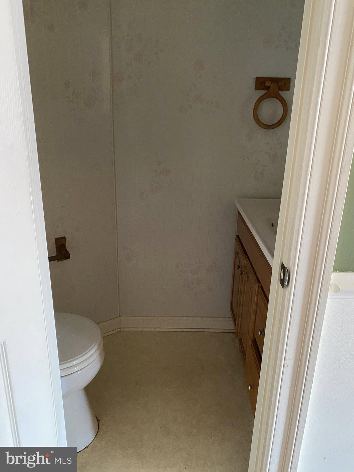 610 Rappolla Street Baltimore, MD 21224 - Photo 18 of 22 a bathroom with a granite countertop toilet and a sink