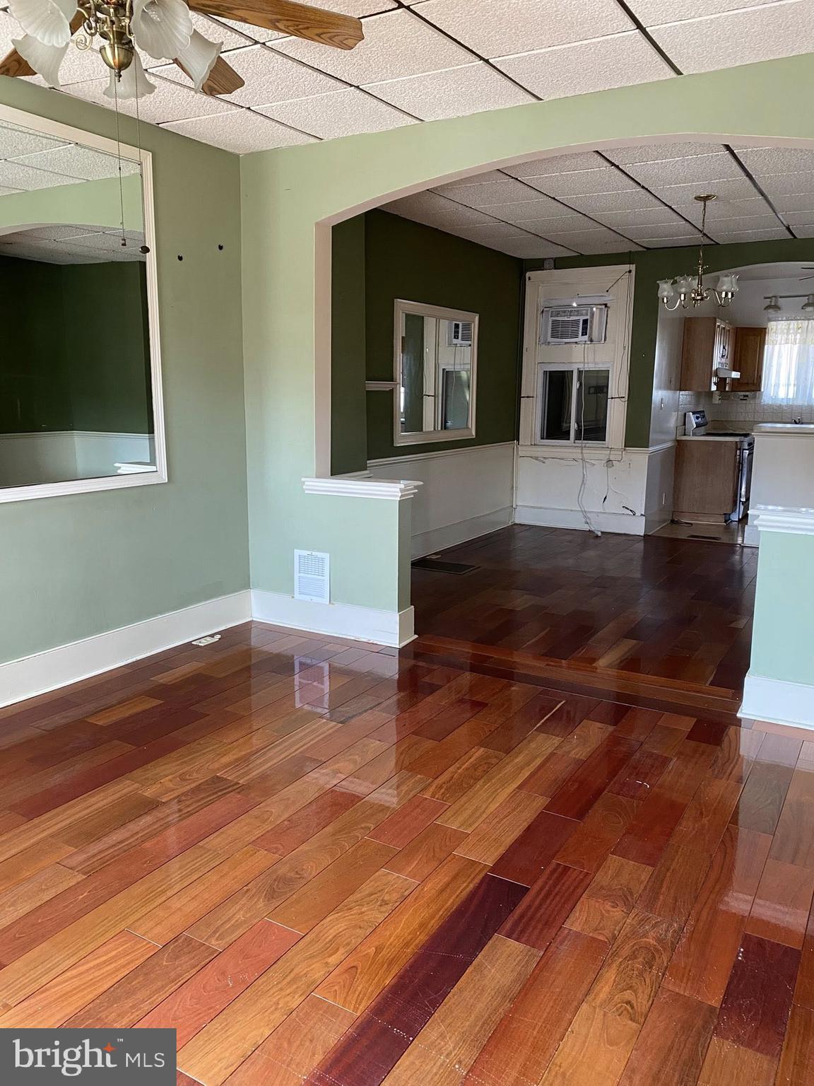 610 Rappolla Street Baltimore, MD 21224 - Photo 2 of 22 a living room with hard wood floors and a fireplace
