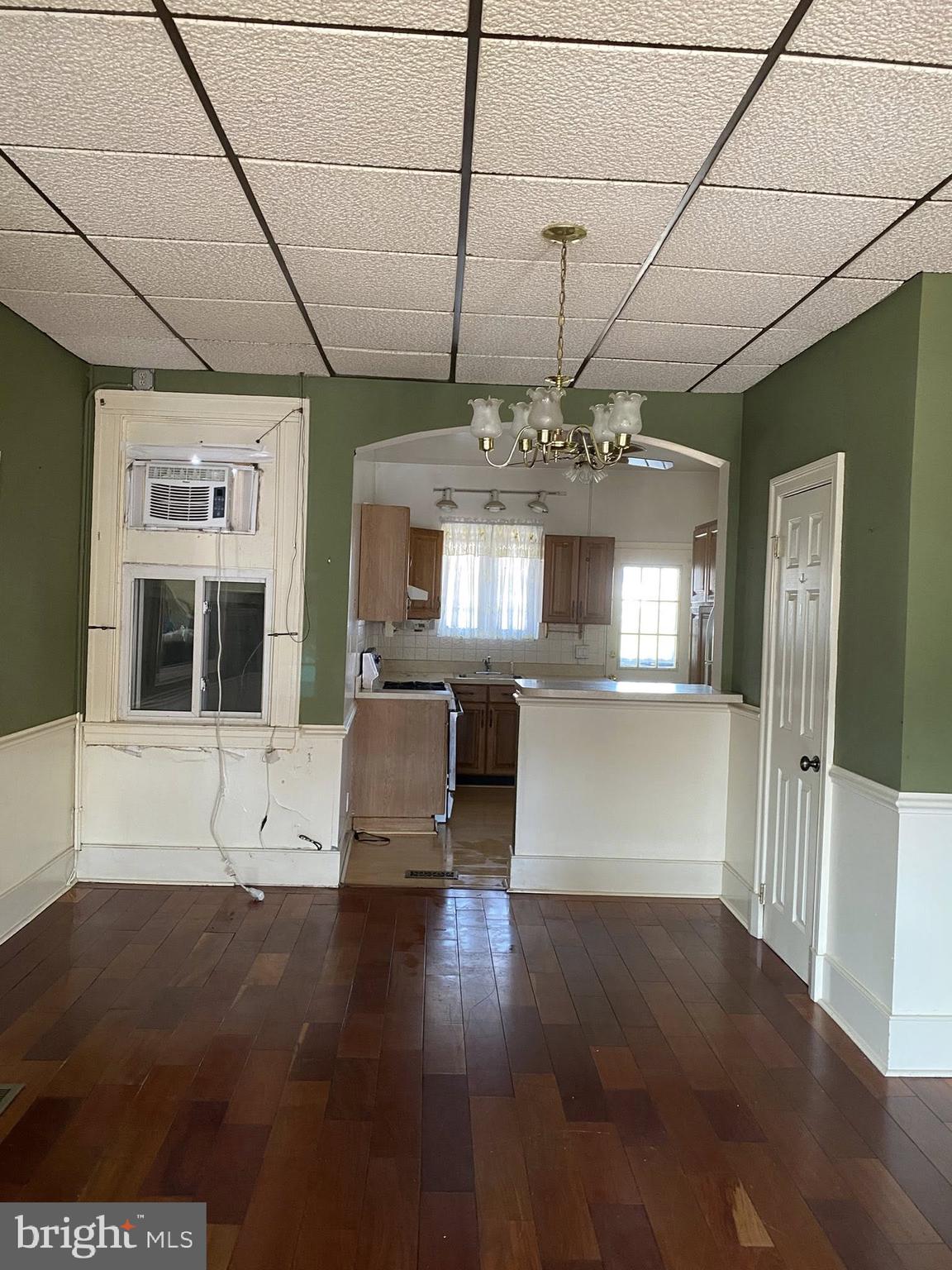 610 Rappolla Street Baltimore, MD 21224 - Photo 8 of 22 a view of a room with kitchen appliances and wooden floor