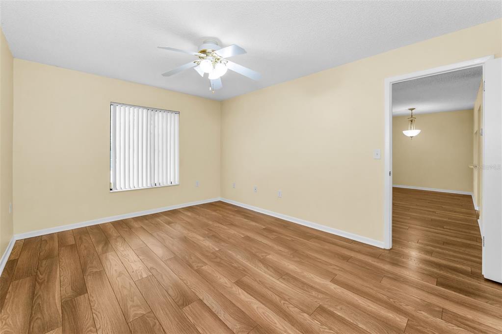 2687 Pine Ridge Way South, Unit F2 Palm Harbor, FL 34684 - Photo 21 of 62 a view of empty room with wooden floor