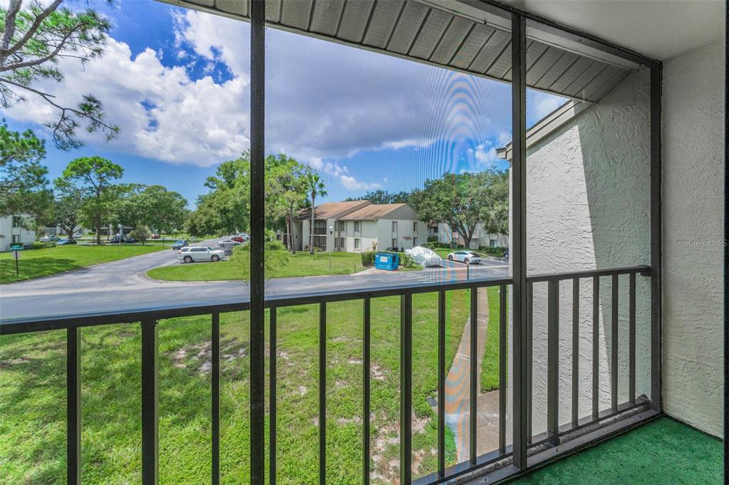 2687 Pine Ridge Way South, Unit F2 Palm Harbor, FL 34684 - Photo 23 of 62 a view of a street from a balcony