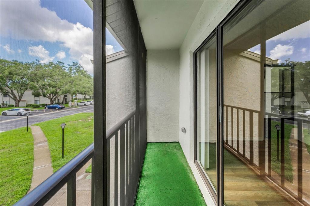 2687 Pine Ridge Way South, Unit F2 Palm Harbor, FL 34684 - Photo 25 of 62 a view of a balcony with a lake view
