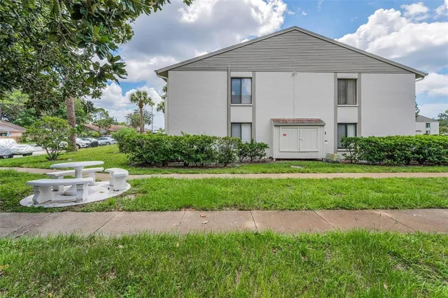 a living room with lots of furniture and wooden floors