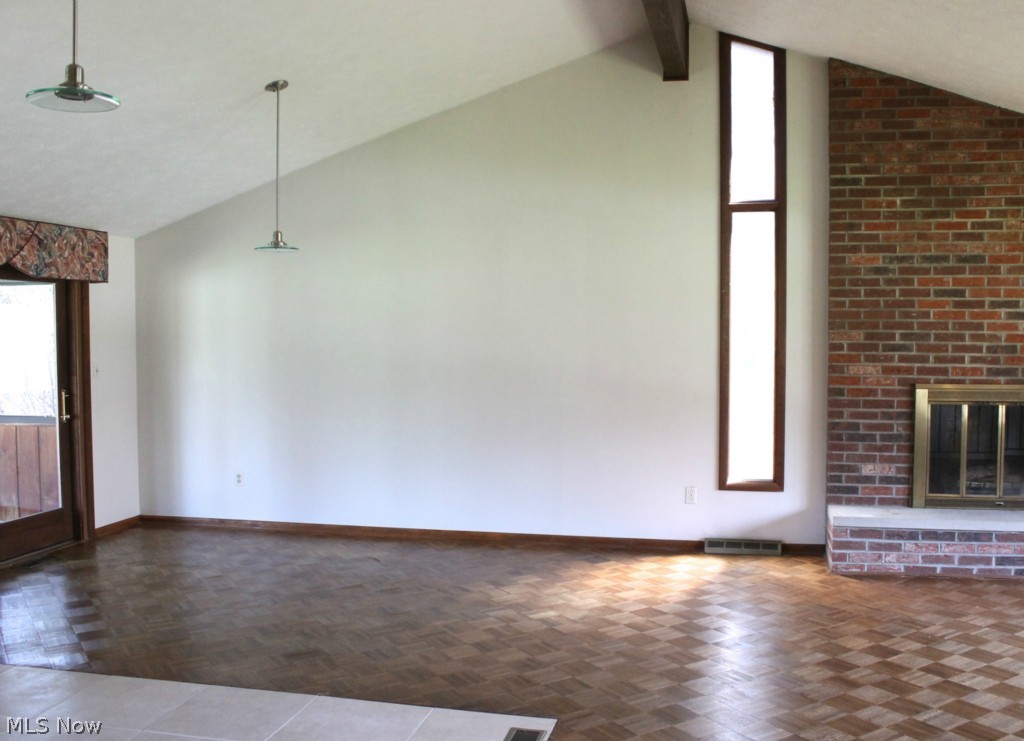 5738 Caranor Road Kent, OH 44240 - Photo 7 of 25 View of living room from hall. Note the ceramic floored kitchen area. Doorway, left, leads into the …