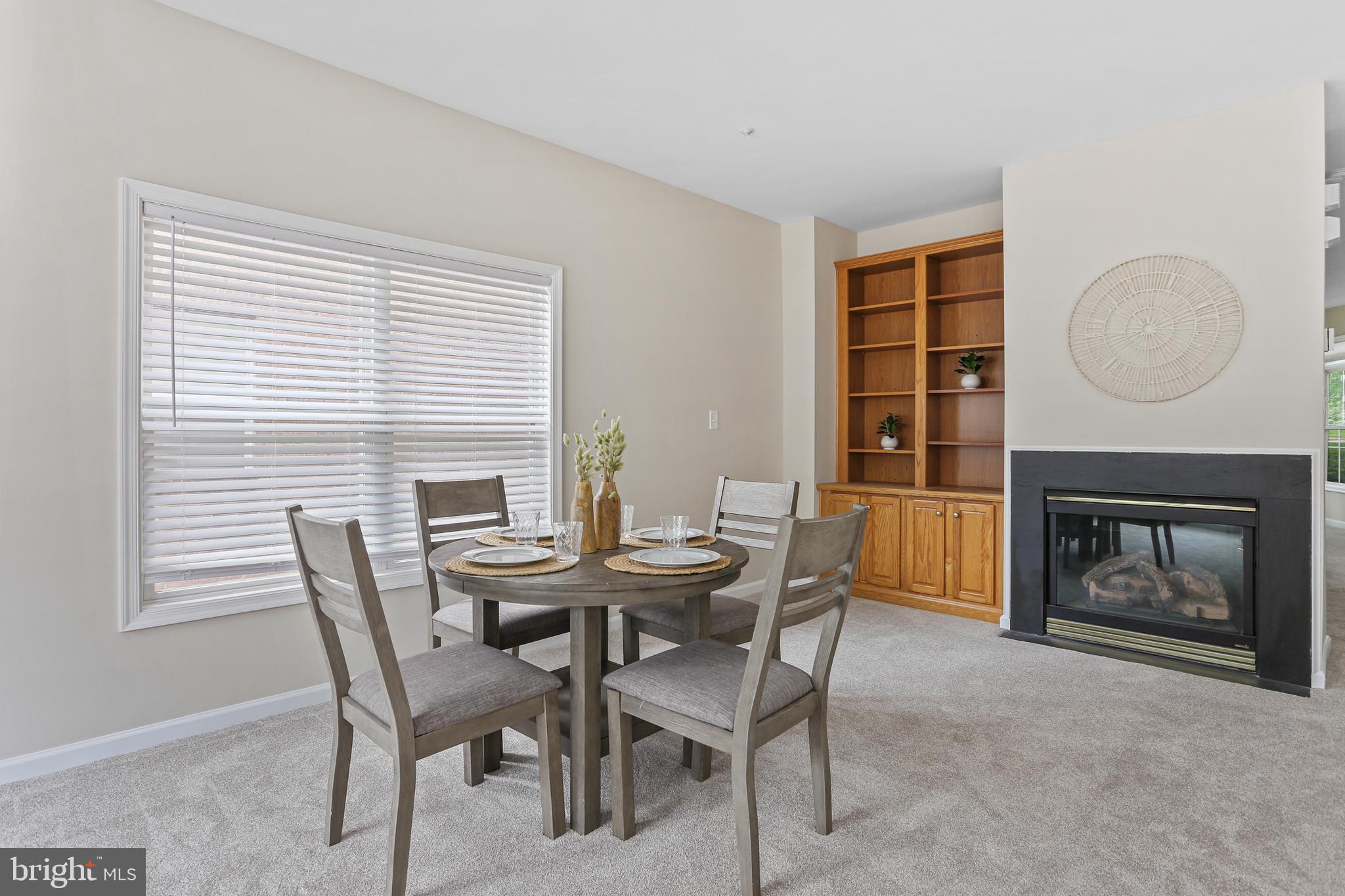 10232 Rutland Round Road, Unit 24 Columbia, MD 21044 - Photo 6 of 31 a dining room with furniture and window
