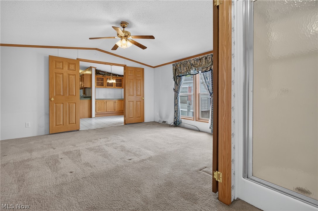 35157 Center Ridge Road, Unit 153 North Ridgeville, OH 44039 - Photo 31 of 35 Recessed lighting, wood-finish doors, ceiling fan, natural light from windows, and a glass-enclosed shower