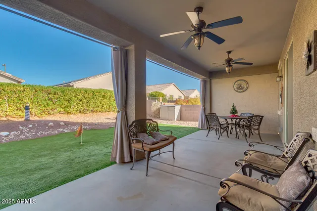 a view of a house with backyard and garden