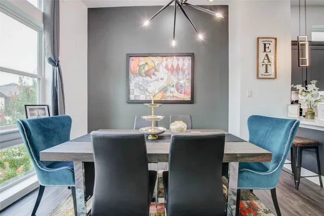 a living room with kitchen island furniture and a wooden floor